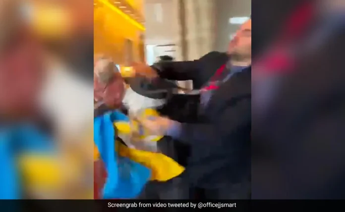 Viral Video: Russian Official Snatches Flag, Ukraine MP Whacks Him